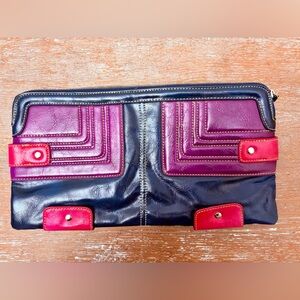 Candie’s clutch with dark teal, purple & pink accents for a pop of color.